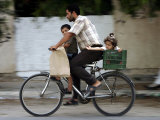 Palestinian Man, 28, Takes His Son, 4, and Daughter, 2, on His Bicycle