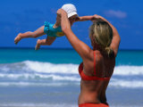 Mother Swinging Baby on Varadero Beach, Varadero, Cuba
