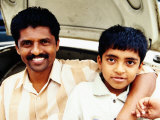 Buy Portrait of Father and Son on Car at Devaraja Market, Mysore, India at AllPosters.com