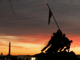 With Washington in the Background, the Sun Rises Behind the Silhouetted Iwo Jima Memorial, Center