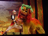 Buy A Man Dressed as Lion Tamer Trains a Lion Played by an Acrobat at AllPosters.com