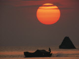 Buy Kabang Silhouetted against the Sea at Sunset at AllPosters.com