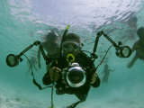 Buy Photographer with Camera Underwater with Diving Moken Tribesmen at AllPosters.com