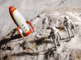 Buy Astronaut Figurines Standing Beside Toy Rocket at AllPosters.com