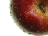 Close-up of a Juicy Red Apple with Shiny Water Droplets