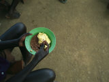 Child Eats Lunch at Amazing Grace Orphanage