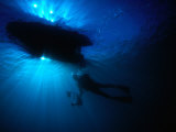 Buy Diver Underneath Boat with Sunlight, Leigh, New Zealand at AllPosters.com