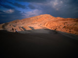Couple of Hikers Walking Through Shadows at Dusk, Valle De La Luna, Chile