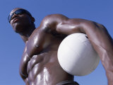 Buy Low Angle View of a Young Man Standing Holding a Volleyball at AllPosters.com