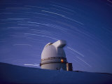 Time-Exposure of the Mauna Kea Observatory Taken at Night, the Streaks in the Sky are Star Trails