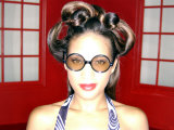 Buy African-American Female with Funky Hair and Glasses at AllPosters.com
