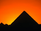 Buy Pyramids of Giza Silhouetted at Sunset,Cairo, Egypt at AllPosters.com