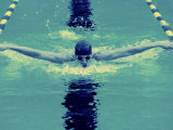 Young Man Swimming the Butterfly Stroke