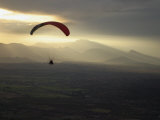 Buy A Botanist Flies over a Field in a Powered Paraglider at AllPosters.com