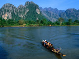 Longboat Crossing Nam Song from Limestone Formations with Honeycomb Caves, Vang Vieng, Laos