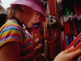 Girl Shopping for Glass Bead Necklaces at Indra Chowk, Kathmandu, Nepal