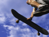 Buy Low Section View of a Young Man Skateboarding at AllPosters.com