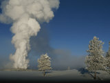 Winter View of Old Faithful Geyser Erupting