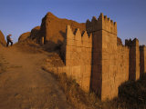 A Man Writes While Standing Near the Massive Walls of Nineveh