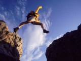 Buy Backpacker Jumping to Rocks, Park City, UT at AllPosters.com