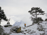 Buy A Member of the Mount Everest Expedition Stands Near a Stone Pagoda at AllPosters.com