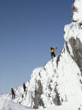 Mountain Climbers Descend a Rime-Plastered Peak