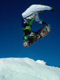 Snowboarder Jumping in Sky, Banff, Canada