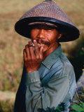 Portrait of a Farm Worker Smoking a Cigarette, Looking at Camera, Ubud, Indonesia