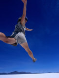 Buy Woman Jumping on Salt Pan, Salar De Uyuni, Bolivia at AllPosters.com