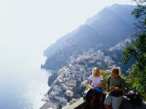 Couple Reading Guidebook on Lookout Above Town, Positano, Italy