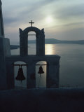 Buy A Bell Tower Silhouetted against the Sea of Crete at Sunset at AllPosters.com