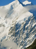 Buy Clouds Drift Past Snowy Mt. Cook on New Zealands South Island at AllPosters.com