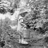 Buy Little Girl with Hat and Pail Outdoors at AllPosters.com