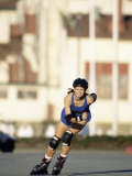 Woman Rollerblading in Safety Gear