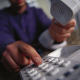 Buy Man Using Phone in Office at AllPosters.com