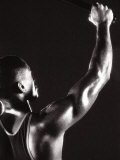 Buy Male Runner Holding Up a Relay Baton at AllPosters.com