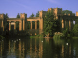 Ornate Columns of Bridge in River with Ducks