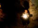 Buy A Palestinian Boy Holds a Sparkler after Breaking the Fast on the First Day of Ramadan in Gaza City at AllPosters.com