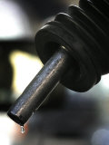 A Drip of Gas Falls from Nozzle at a Gasoline Station