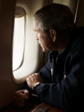 Buy President Bush Looks out the Window of Air Force One Over New Orleans at AllPosters.com