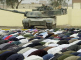Iraqi Shiite Muslims Pray on the First Day of Eid Al-Fitr