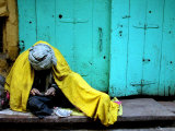 A Muslim Man Warms Himself