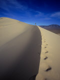 Buy Woman Hiking, Kelso Sand Dune, CA at AllPosters.com