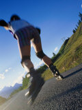 Buy Woman Roller-Blading Along Mountain Road, Canada at AllPosters.com