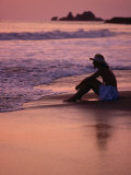 Buy Woman Sitting on Beach at Sunset in Ixtapa, Near Zihuatanejo, Zihuatanejo, Mexico at AllPosters.com