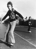 Buy Boy Balances on His Skateboard with a Look of Concentration on His Face at AllPosters.com