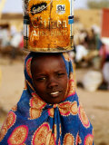 Girl in Colourful Wrap Balancing Paint Tin on Head, Agadez, Niger
