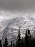 Emmons Glacier Reflects a Bit of Sunlight as Clouds Cover the Summit of Mount Rainier