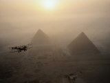 The Vimy Flies Above Fog-Shrouded Pyramids During a Golden Sunrise at Giza, Egypt