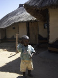 Buy Child by Straw Hut, South Africa at AllPosters.com